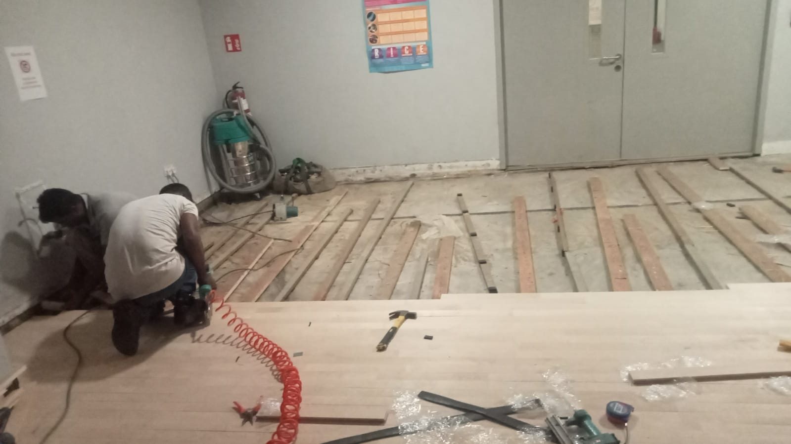 International school Maple hardwood flooring replacement — damaged board removal, new Maple boards laid and refinished